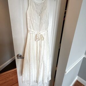 Bridal dress. Lovely ivory color  with small white pearls on bodice.